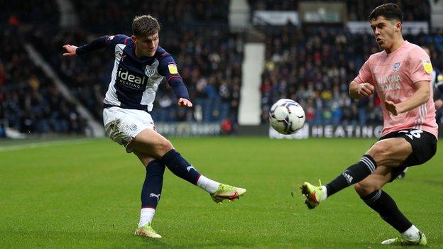 Taylor Gardner-Hickman of West Bromwich Albion tries to cross with Ryan Giles of Cardiff City blocking the ball