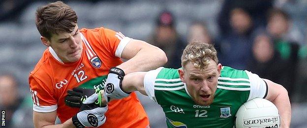 Armagh's Niall Grimley battles with Fermanagh's Aidan Breen