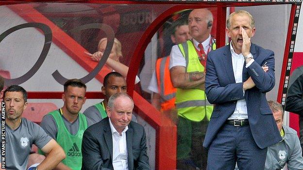 Paul Trollops shouts encouragement to his team as assistant Lennie Lawrence looks on