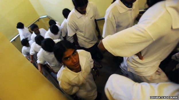 A group of former Tamil Tiger women fighters visit Sri Lanka's parliament building just outside the capital of Colombo in December 2011