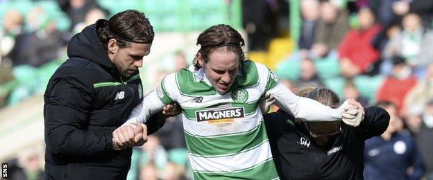 Celtic midfielder Stefan Johansen receives treatment on an injury