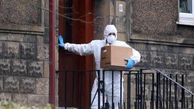 Forensic officer at Pacteau's flat