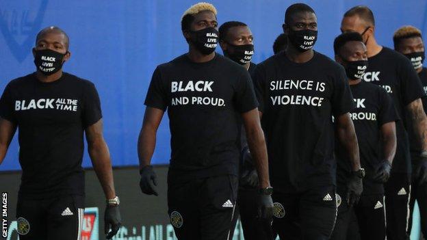 Players wore T-shirts sporting messages of protest