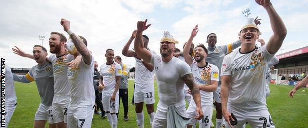 Newport's players celebrate reaching the play-offs