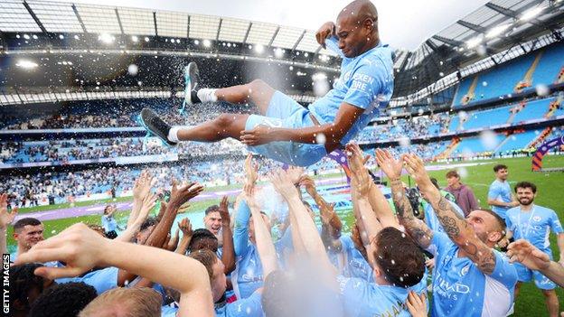 Manchester City celebrate winning the Premier League