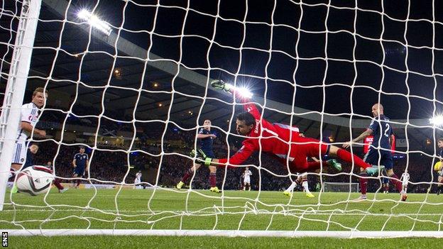 Ilkay Gundogan scores for Germany against Scotland