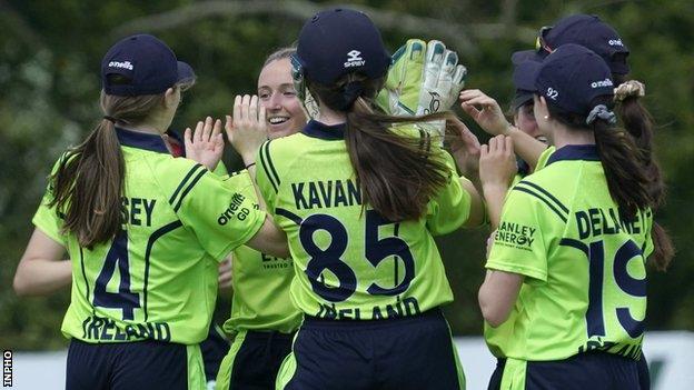 Ireland's women celebrate taking a wicket