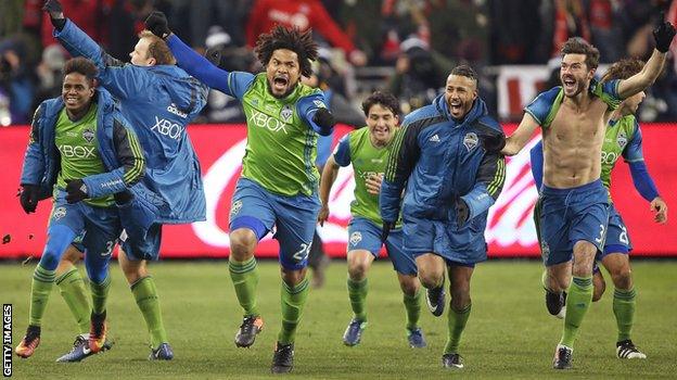 Roman Torres celebrates with his Seattle Sounders team-mates