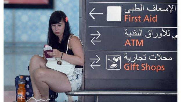 A British tourist waits to leave Tunisia at Enfidha International Airport following the attack