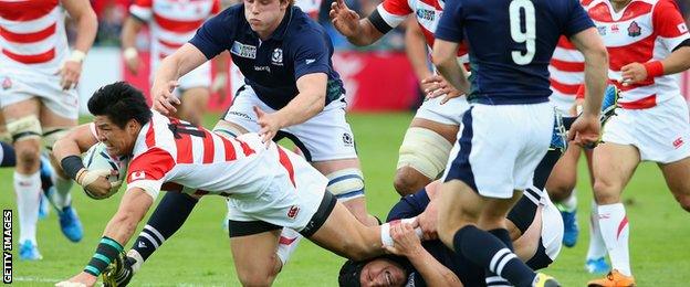 Harumichi Tatekawa scores a try against Scotland at the World Cup