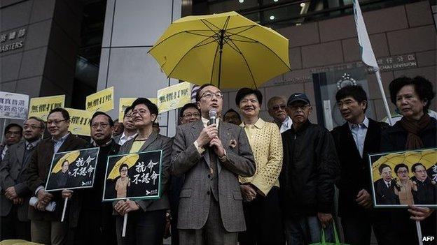 Pro-democracy legislator Alan Leong says a few words to the media outside the Wanchai police station in Hong Kong on March 2, 2015