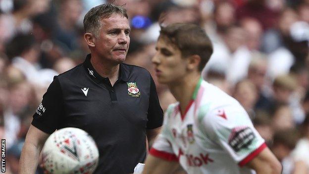 Wrexham manager Phil Parkinson loos on