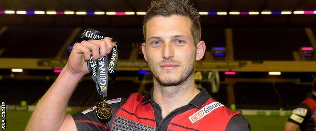 Jason Tovey shows off his man-of-the-match medal