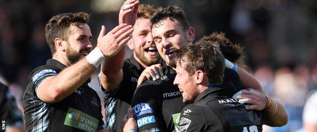 Glasgow Warriors celebrate a try from Adam Ashe