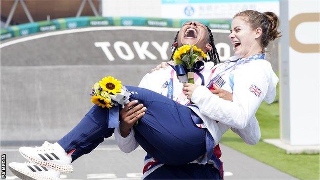 Kye Whyte carries Bethany Shriever