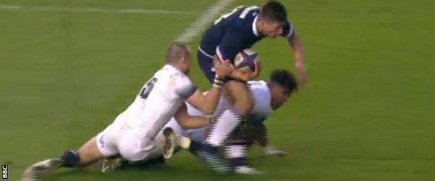 Mike Brown tackles Huw Jones