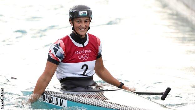 Mallory Franklin smiles in her canoe