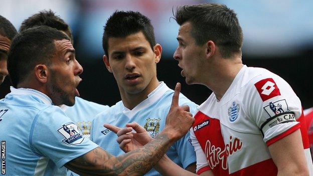 Joey Barton argues with Carlos Tevez in 2012