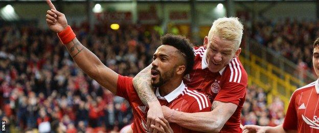 Shay Logan (left) celebrates after giving Aberdeen the lead