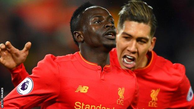 Sadio Mane (left) celebrates scoring for Liverpool against Tottenham