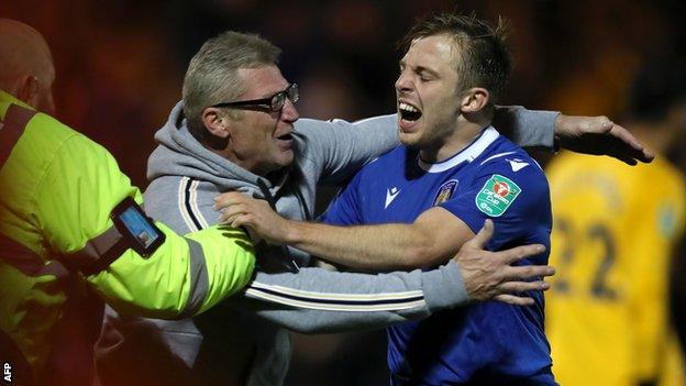 Tom Lapslie celebrates on the pitch