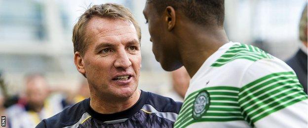 Brendan Rodgers shakes hands with Celtic youngster Darnell Fisher in August 2013