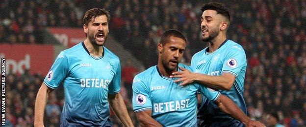 Wayne Routledge celebrates after equalising for Swansea