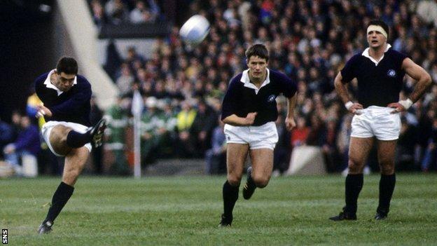 Gavin Hastings (left) in action for Scotland