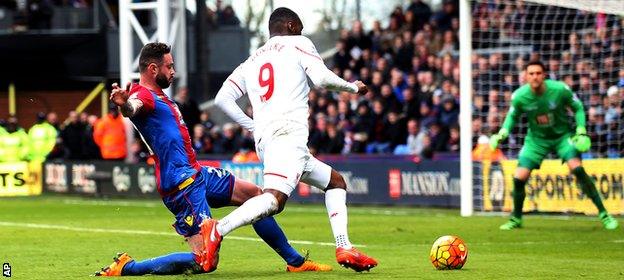 Delaney's right knee caught Benteke's right foot