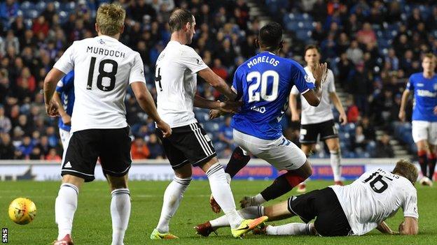 Rangers striker Alfredo Morelos is tackled by Jamie Adams of Ayr United