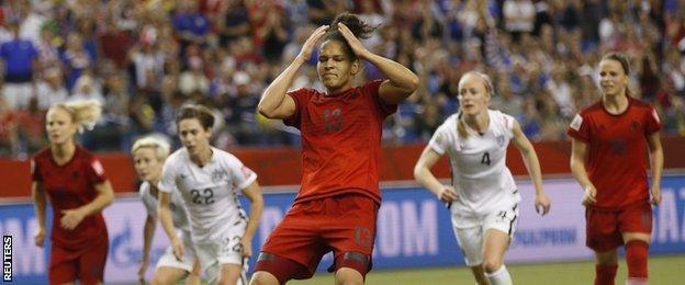 Celia Sasic (centre) reacts after her penalty miss