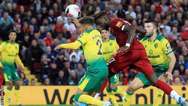 Divock Origi (right) scores