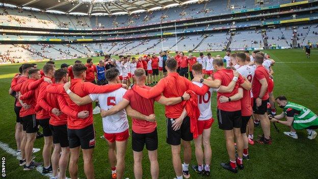 Feargal Logan leads a team talk after the match