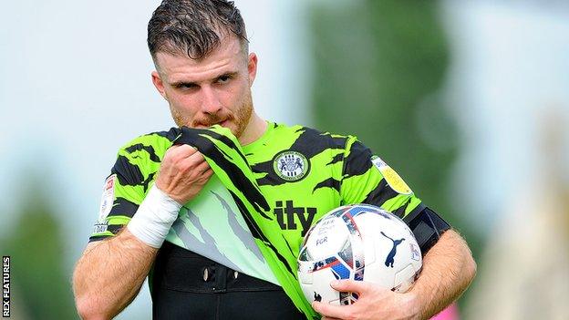 Forest Green's Nicky Cadden celebrates with the matchball