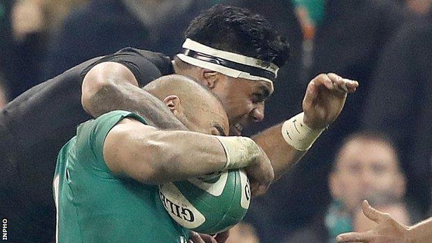 Malakai Fekitoa tackles Simon Zebo during the second half at the Aviva Stadium