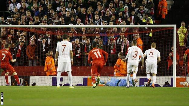 Liverpool midfielder James Milner scores a penalty against Augsburg