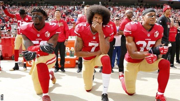 Eli Harold, Colin Kaepernick and Eric Reid take a knee as protest against police brutality and racial injustice