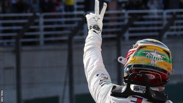 Lewis Hamilton wearing an Ayrton Senna inspired helmet