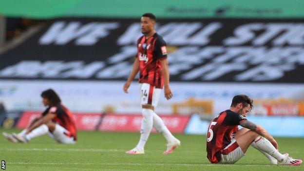 Bournemouth players looking dejected after losing at Wolves