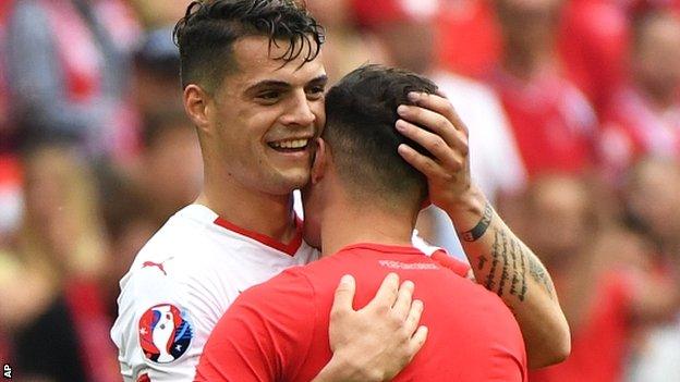 Granit Xhaka (left) greets his brother Taulant