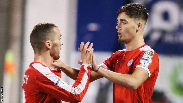 Martin Donnelly celebrates with Cliftonville goalscorer Jay Donnelly