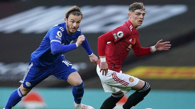 Brandom Willisms of Manchester United challenges Leicester's James Maddison.