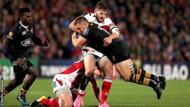 Ulster's Stuart McCloskey tackles Wasps fly-half Jimmy Gopperth