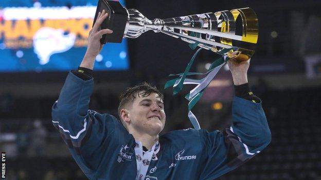 Kell Beattie celebrates with the Challenge Cup after the win over Cardiff Devils in the final