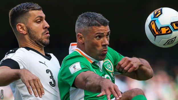 Aleksandar Dragovic of Austria closes in on the Republic of Ireland's Jonathan Walters