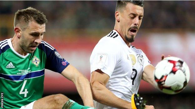 Northern Ireland defender Gareth McAuley in action against Sandro Wagner of Germany