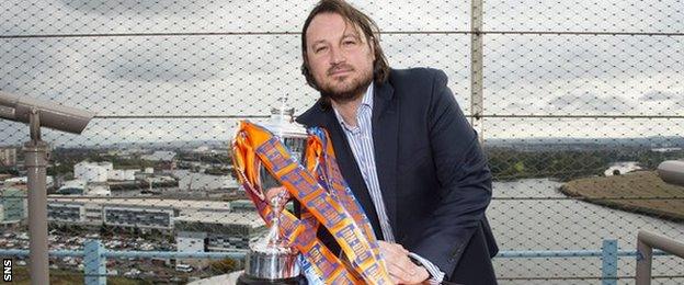 New Saints manager Craig Harrison with the Scottish Challenge Cup