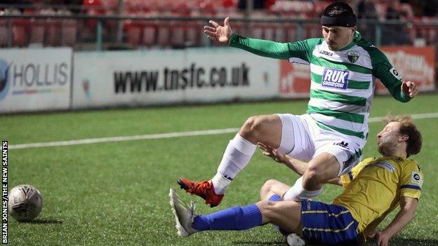 Saints' Adrian Cieślewicz in action against Barry Town