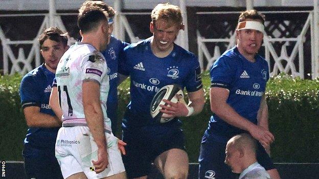 Jamie Osborne (centre) shows his delight after scoring Leinster's second try