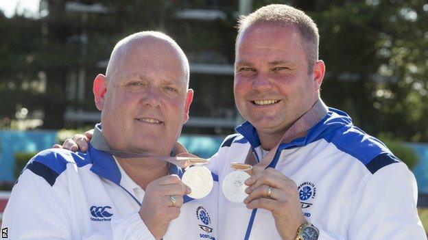 Alex Marshall and Paul Foster show off their silver medals